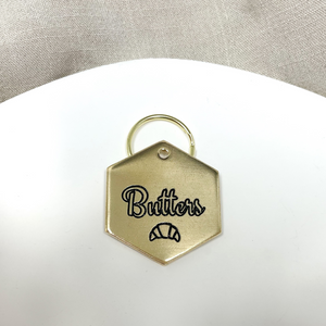 Personalized Dog Tag - Croissant Design Engraved Dog Tag - Cat ID Tag - Dog Collar Tag - Custom Dog Tag - Personalized Tag - Pet ID Tag - Pet Name Tag - Butters - Dog Gear - Croissant Dog Tag - Dog Accessories - Pet Accessories - Pet name on front with a croissant design. Your phone number will be on the back. 