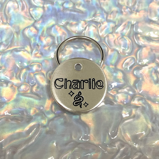 Snake and Stars Design Engraved Dog Tag - Cat ID Tag - Dog Collar Tag - Custom Dog Tag - Personalized Tag - Pet ID Tag - Pet Name Tag - Pet name on front with a snake and stars design. Your phone number will be on the back.