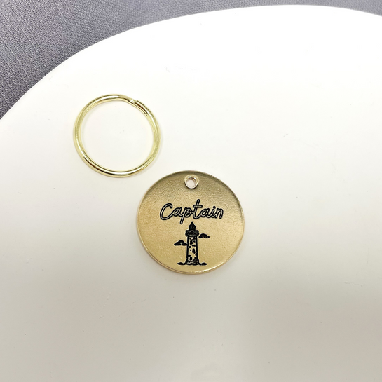 Lighthouse Design Engraved Dog Tag - Cat ID Tag - Dog Collar Tag - Custom Dog Tag - Personalized Tag - Pet ID Tag - Pet Name Tag - Pet name on front with a lighthouse design. Your phone number will be on the back.